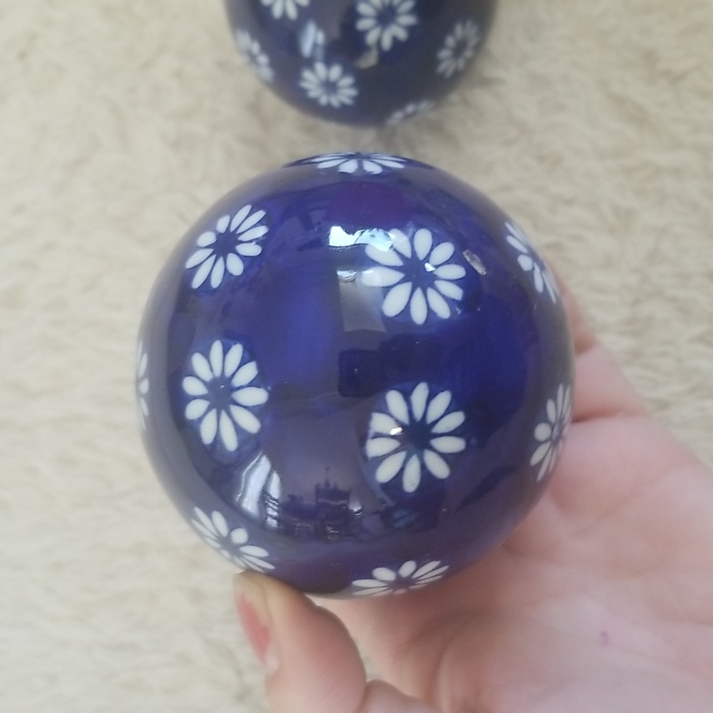 Two vintage blue and white spherical porcelain ball design